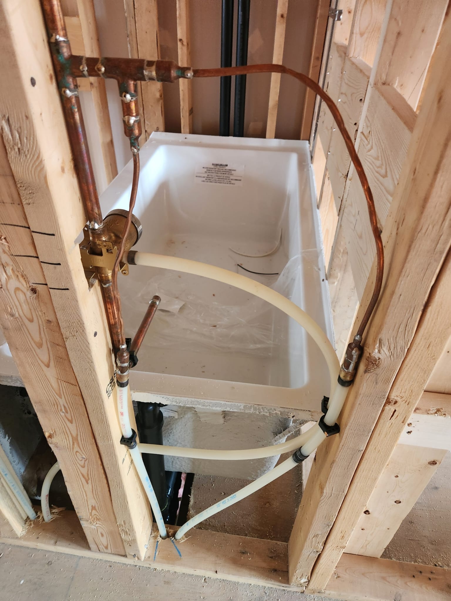 Copper and PEX rough-in plumbing for a new bathtub installation
