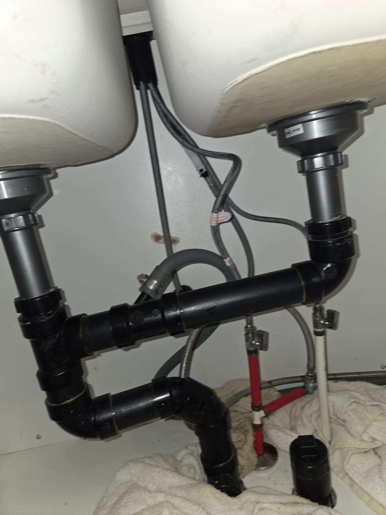 Garbage disposal unit connected under a kitchen sink